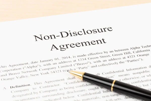 Non disclosure agreement document with pen — Stock Photo, Image