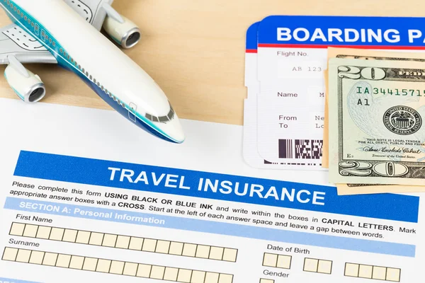 Travel insurance application form with plane model, boarding pas — Stock Photo, Image