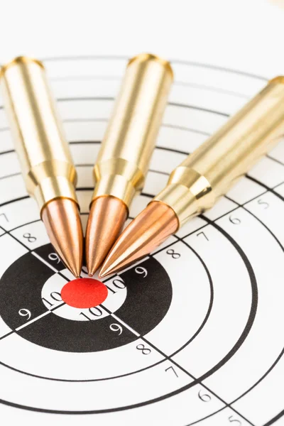 Rifle bullet over target background — Stock Photo, Image