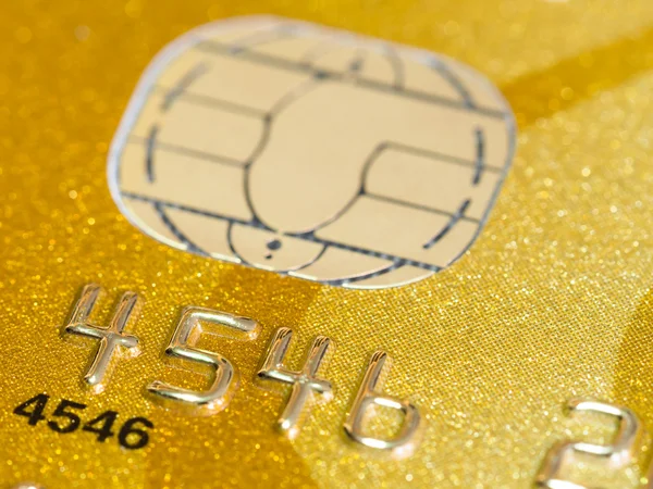 Gold credit card with micro chip selective focus — Stock Photo, Image