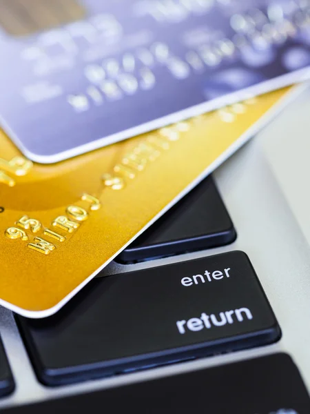 Two credit cards on a computer keyboard — Stock Photo, Image