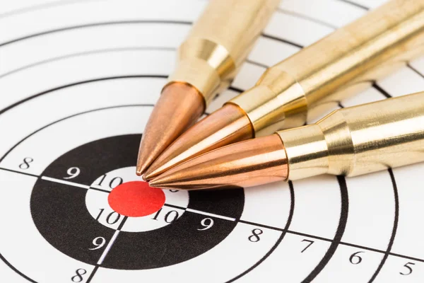 Rifle bullet over target background — Stock Photo, Image