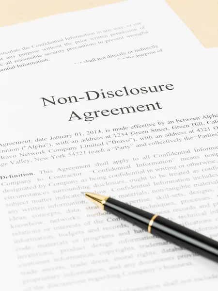 Non disclosure agreement document with pen — Stock Photo, Image