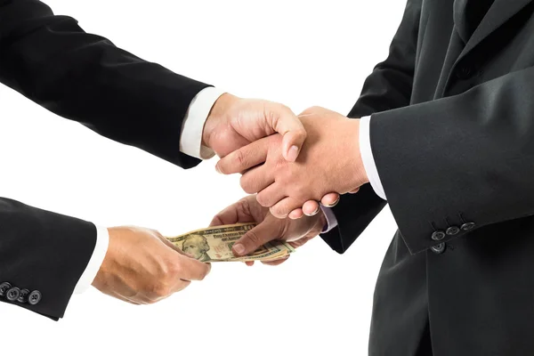 Buisnessmen shaking hands and receiving banknote — Stock Photo, Image