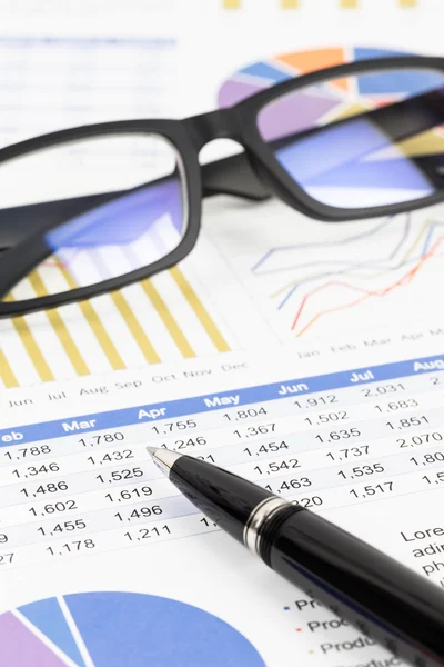 Sales report analysis with pen, and glasses — Stock Photo, Image