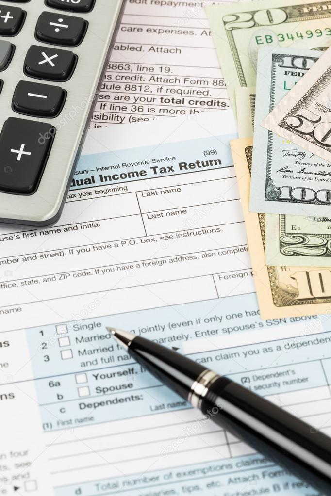 Tax form with pen, banknote, and calculator taxation concept