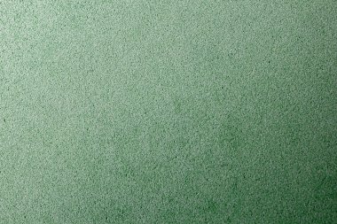 Soyut arka plan, yeşil doku, kadife kumaş, yakın plan. Fotokopi alanı ile arka plan için renkli keçeli kumaş. Keçeli kumaş.