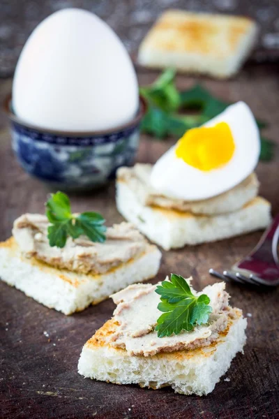 Rustic breakfast, boiled egg and toast with liver pate — Stock Photo, Image