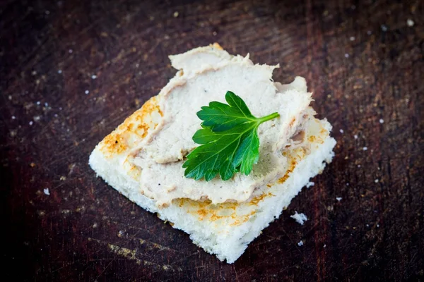 Rustic breakfast, toast with liver pate on board — Stock Photo, Image