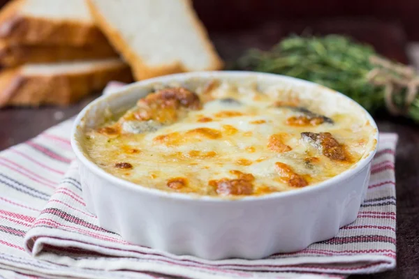 Mushrooms gratin with cream, cheese, French dish julienne — Stock Image Mushrooms gratin with cream, cheese, French dish julienne Royalty Free Stock Images
