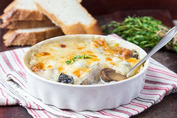 Mushrooms gratin with cream, cheese, French dish julienne — Stock Image Mushrooms gratin with cream, cheese, French dish julienne Royalty Free Stock Images