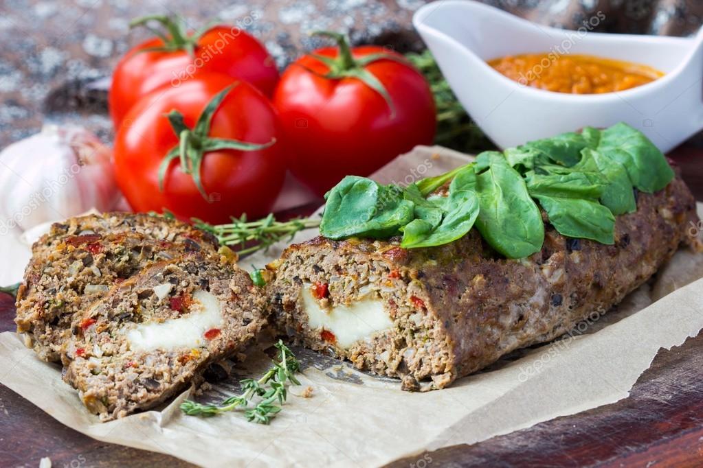 Meat roll, meatloaf, minced beef with vegetables, olives, mozzar