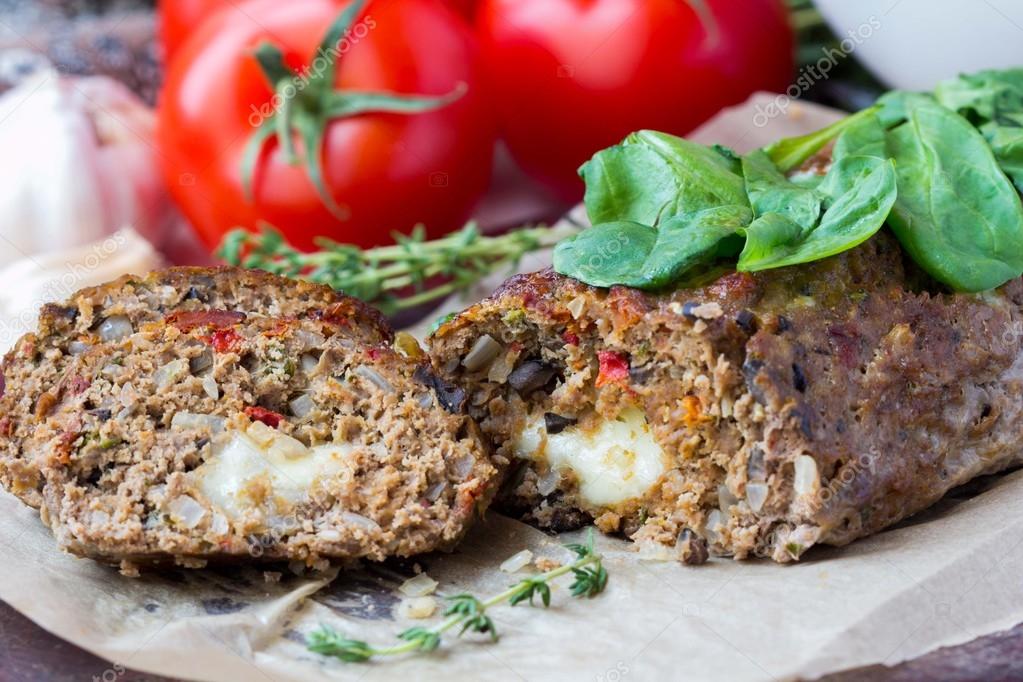 Meat roll, meatloaf, minced beef with vegetables, olives, mozzar