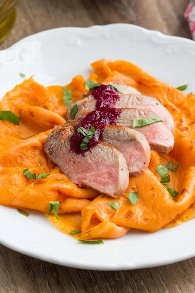 Tomato red pancakes with roasted duck and berry sauce gooseberry — Stock Photo, Image