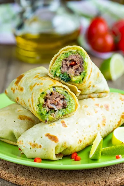 Pancakes stuffed with avocado sauce, meat beef kebab, Mexican ro — Stock Photo, Image