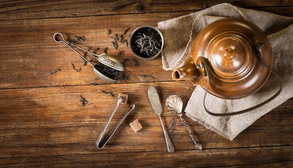 Tea concept (dry tea and kettle), above view. — Stock Photo, Image