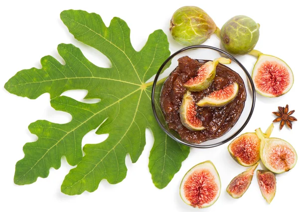 Fresh figs with leaves and fig jam  in bowl, top view — Stock Photo, Image