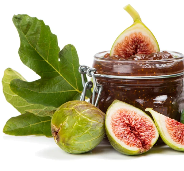 Fig jam in a preserving glass and fresh fruits with leaves — Stock Photo, Image