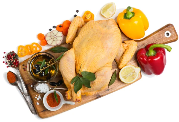 View from above of whole raw chicken ready to roast with cooking — Stock Photo, Image