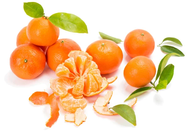 Ripe sweet tangerine with leaves and slices — Stock Photo, Image