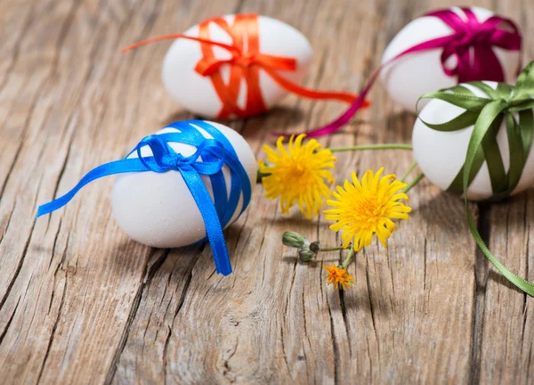 Easter eggs and with yellow flowers — Stock Photo, Image