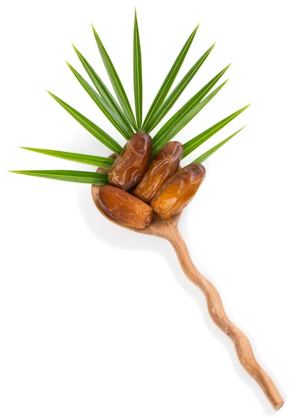 Date fruits in a spoon — Stock Photo, Image