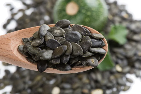 Pumpkin seeds in the spoon — Stock Photo, Image