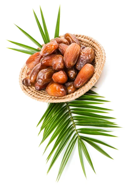 Wicker plate of date fruits — Stock Photo, Image