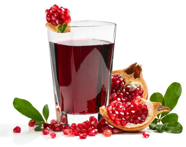 Glass of pomegranate juice with fruits — Stock Photo, Image