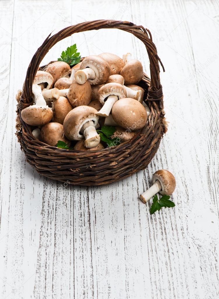 Basket with champignon mushrooms