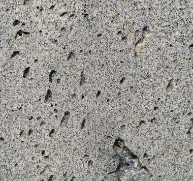 Kumaşın dokusu ve arkaplanı. Duvardaki sivilcelerde benzersiz bir çimento dokusu var..