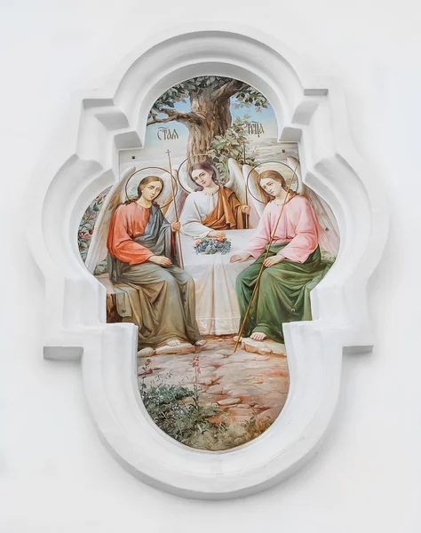 Holy Trinity. The bas-relief on the wall of the temple of the Holy Trinity in the city of Poltava, Ukraine. April 16, 2016 — Stock Photo, Image