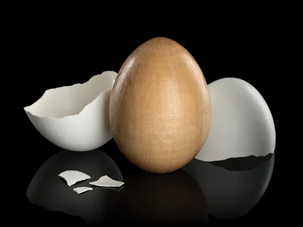 Wooden egg in a natural shell — Stock Photo, Image