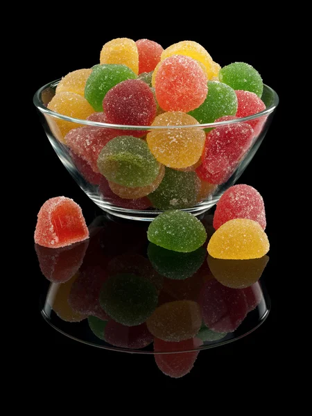 Glass vase with multi-colored fruit candy — Stock Photo, Image