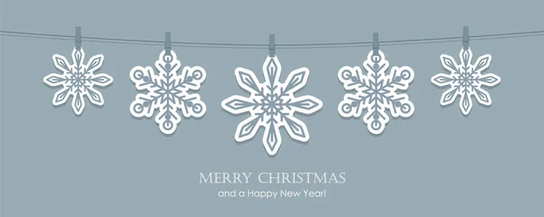 Graue Weihnachtskarte mit hängenden Schneeflocken — Stockvektor