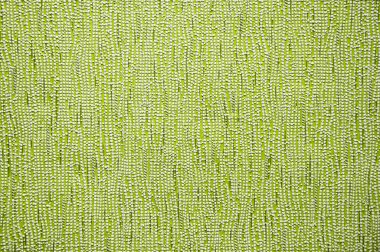 Dikey eğri çizgileri olan yeşil soyut doku duvar kağıdı arkaplanı.