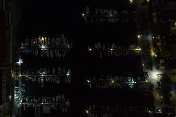 Overnight yacht parking. Night bay of Sevastopol from a bird\'s eye view. At night, the yachts are parked in the parking lot.