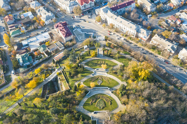 Malakhov kurgan, central entrance from above. Central staircase to the mound. The bright sun illuminates the colorful trees.