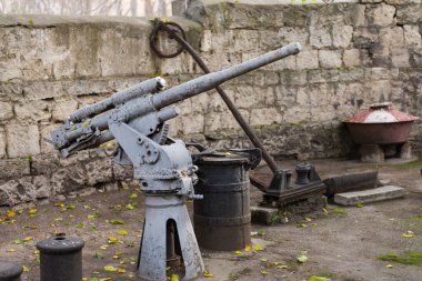 An old gun from a submarine. Ship's gun of the 30s.