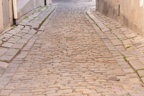 Stone pavement on the street. Old pavement in the historical part of Bratislava in Europe.