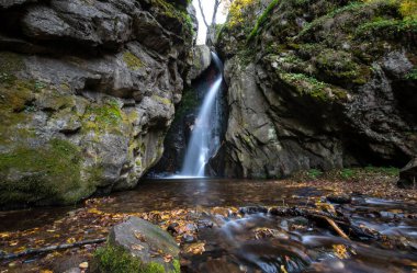 Fotinovo waterfalls (Fotinski waterfall) in Rhodopes Mountain, Pazardzhik region, Bulgaria. Amazing autumn landscape clipart