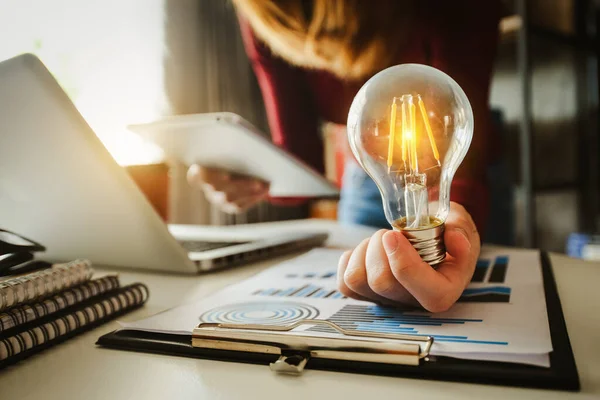 Business Woman Using Smartphone Tablet Holding Light Bulb Idea Innovation — Stock Photo, Image