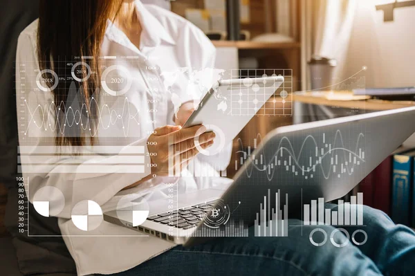 Financial report data of business operations (balance sheet and income statement and diagram) as Fintech concept.Business team meeting. digital tablet and computer laptop.