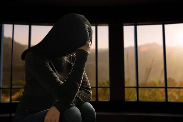 woman sit Depression Standing by window and anxiety Copy space.