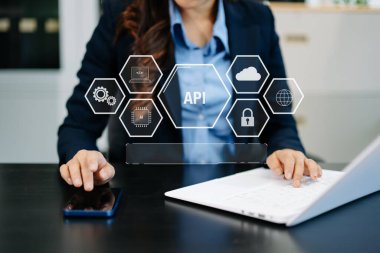 API Application Programming Interface, woman using laptop, tablet and smartphone with virtual screen API icon Software development tool, modern technology and networking concept
