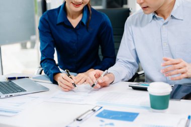Businessman and team analyzing financial statement Finance task. with smart phone and laptop and tablet. Wealth management concept.	