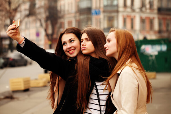 Three beautiful friends having fun outdoor