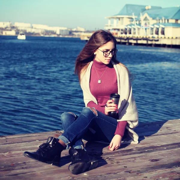 Beautiful bohemian woman posing on a sea background. — Stock Photo, Image