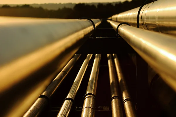 Close up view of steel golden pipes in refinery Royalty Free Stock Images