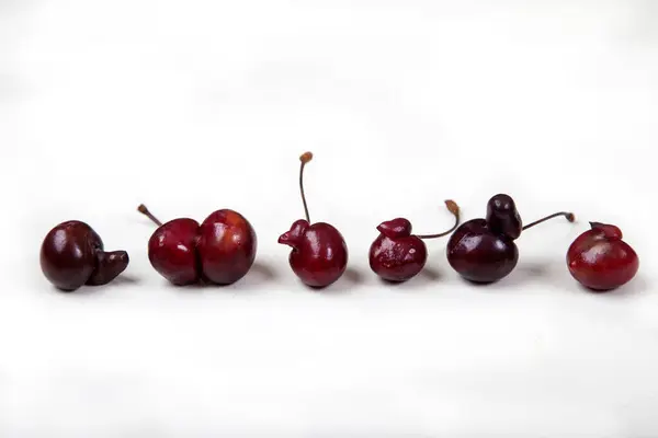 Ugly Funny Cherries Sweet Cherries White Background Healthy Food Concept — Stock Photo, Image